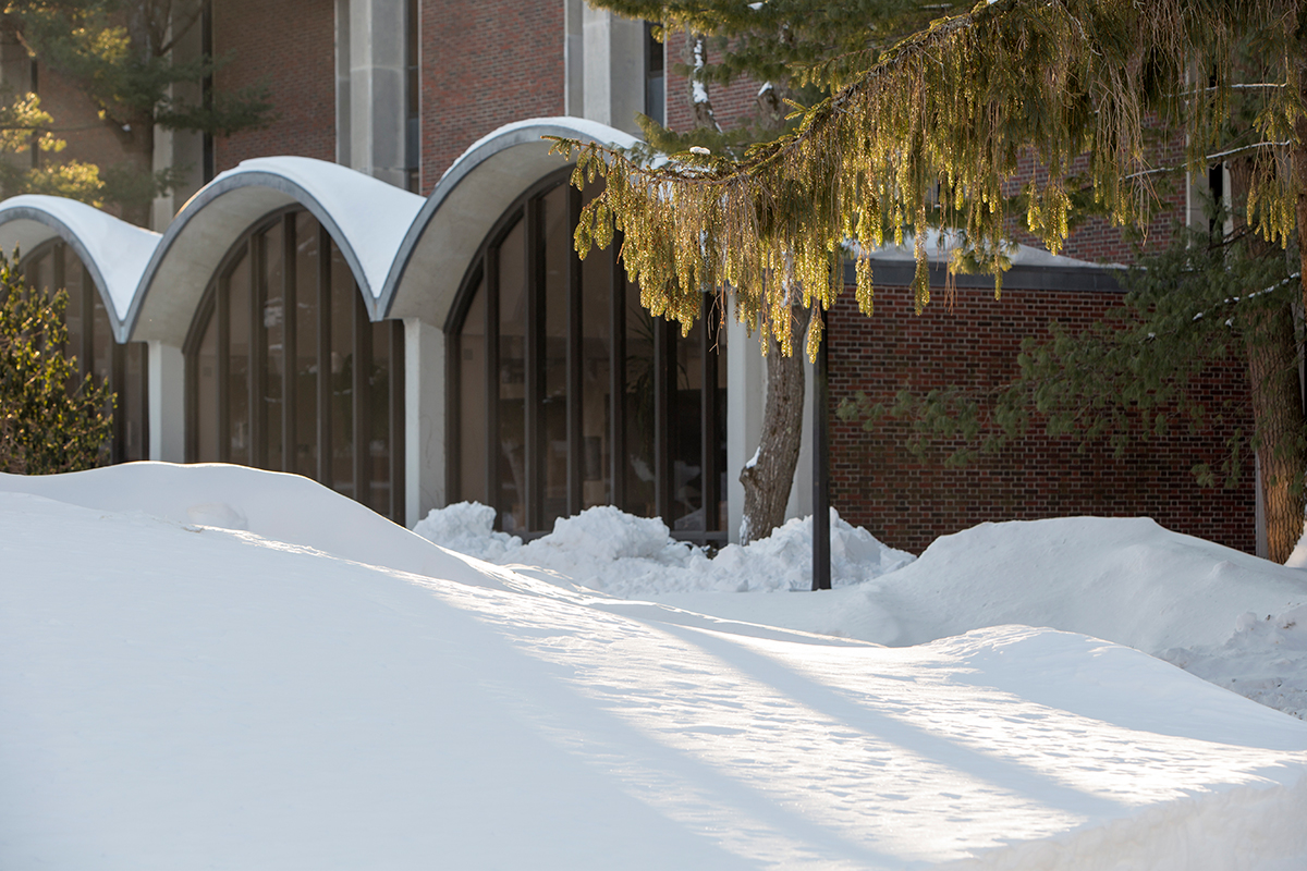Hawthorne-Longfellow Library's arched windows partially buried by lots of snow