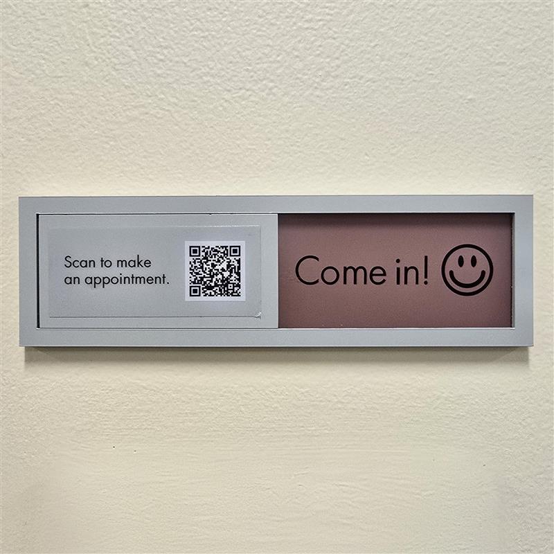 A sign saying 'Come In!' with a smiley face