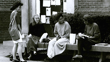 September 1991. Students socializing near the entrance of a dormitory.