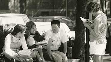 May 1991. Four students informally chatting on campus.