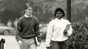 Undated. Two students walking on campus.