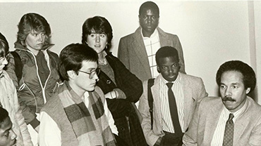 1986. Randall Robinson (far right) of TransAfrica, meeting with students during Black History month.