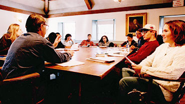 Undated. Students in Professor Frank Burroughs' English class. (Professor Burroughs is in the left foreground with his back to the camera).