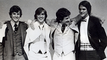 Undated. Students Celebrate at the Bowdoin Film and Video Society Awards Night. Four unidentified male students stand in a line, with their arms around each other.