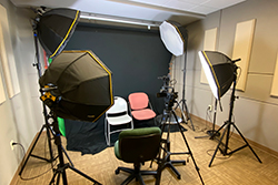 Recording studio with chairs and multiple light sources