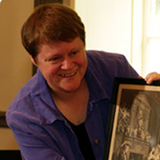 Professor Kibbie holding a framed picture